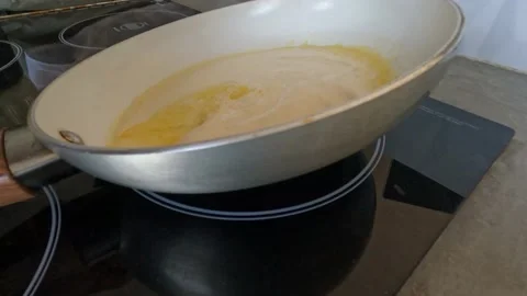 Pancake in a pan cooking. A Flour-based food. Stock Footage 206798879