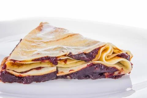 Pancake with plum jam Stock Photos