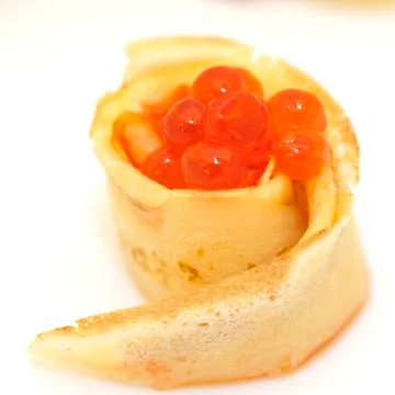 Pancake roll with red caviar Stock Photos