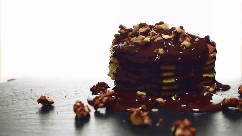 Pancake sprinkled with walnuts Stock Footage 72149956