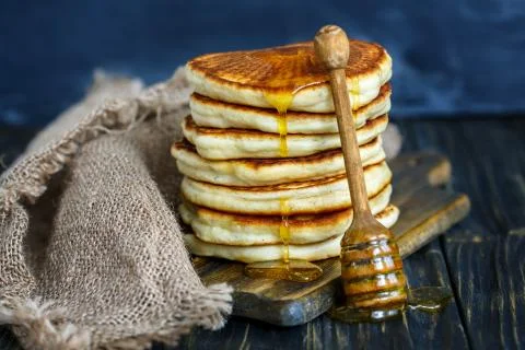 Pancake stack with honey. Stock Photos