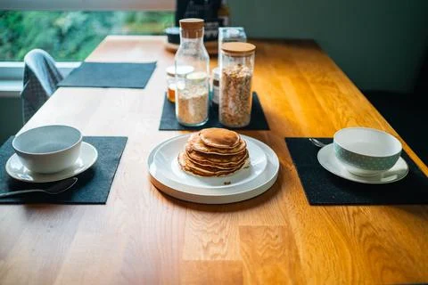 Pancake Stack on a Plate of a Wooden Breakfast Table Stock Photos