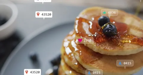 Pancake stack receiving syrup stream, notification badges appearing and 스톡 동영상 323273553