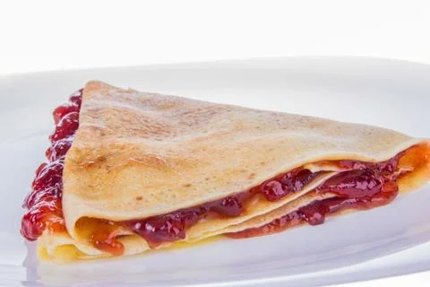 Pancake with strawberry jam Stock Photos