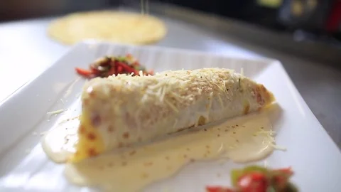 Pancake stuffed with vegetables, Vegetable crepe with sesame Stock Footage 83644871