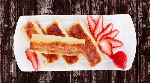 Pancake with various fillings served over old style wooden table Stock Footage