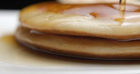 Pancakes and maple syrup macro slow motion 4K Stock Footage 148962472