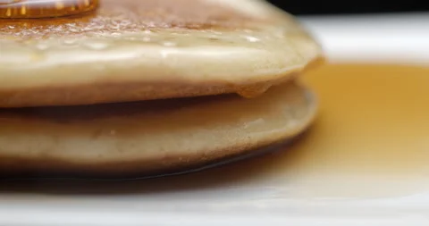 Pancakes and maple syrup macro slow motion 4K Stock Footage 148962482