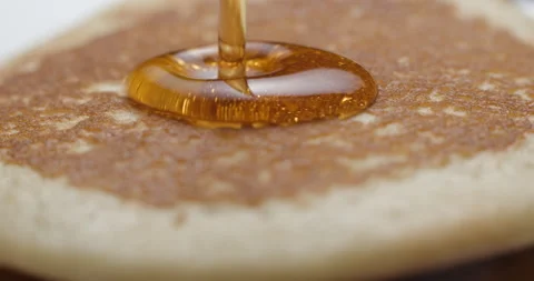 Pancakes and maple syrup macro slow motion 4K Stock Footage 148962668