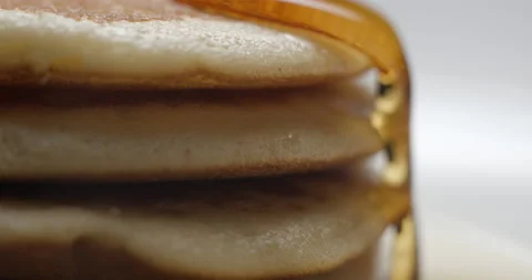 Pancakes and maple syrup macro slow motion 4K Stock Footage 149009117