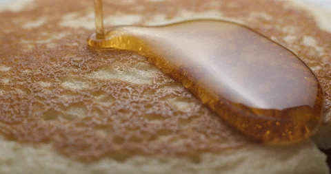 Pancakes and maple syrup macro slow motion 4K Stock Footage 149009220