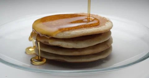Pancakes and maple syrup macro slow motion 4K Stock Footage 149015201