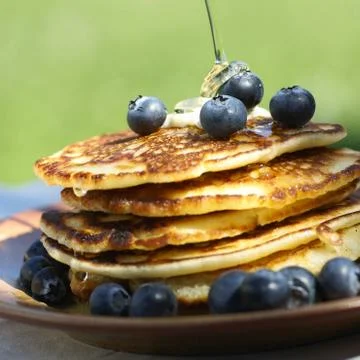 Pancakes and maple syrup Stock Photos