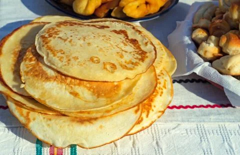 Pancakes and muffins on the table. Stock Photos