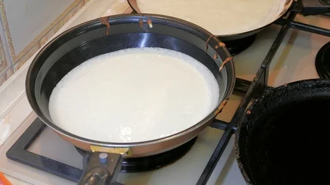 Pancakes are fried in a pan 스톡 동영상 123588162