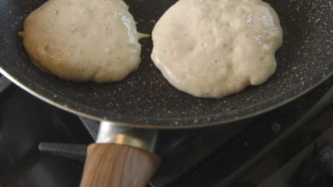 Pancakes being cooked on a pan Stock Footage 122183433