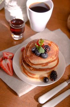 Pancakes with Berries for Breakfest on a Sunny Morning Stock Photos