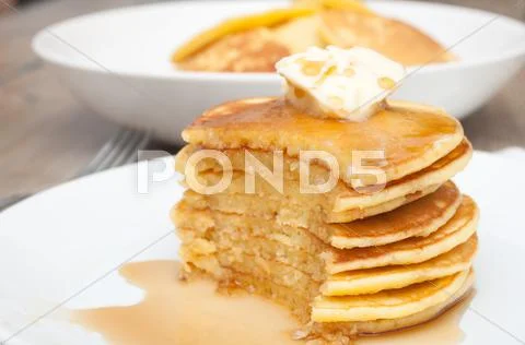 Pancakes with butter and maple syrup Stock Photos