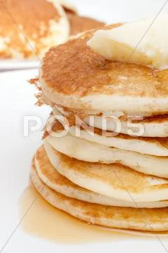 Pancakes with butter and maple syrup Stock Photos