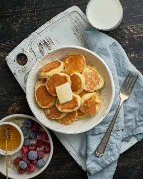 Pancakes cereal, tiny thin funny crumpet, children s food. Breakfast with ... Foto stock