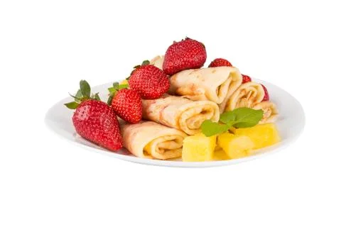 Pancakes with cherry jam c pineapple and strawberries Stock Photos