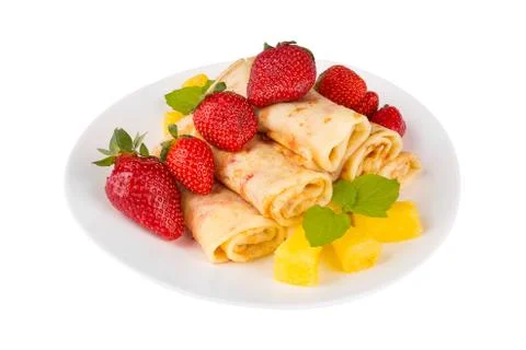 Pancakes with cherry jam c pineapple and strawberries Stock Photos