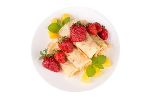 Pancakes with cherry jam c pineapple and strawberries Stock Photos