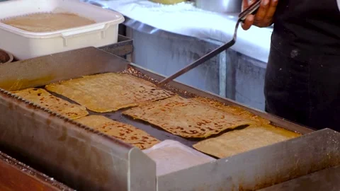 Pancakes cooking on the plate Video stock 169980919