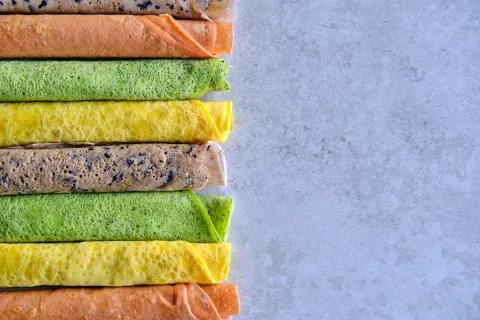 Pancakes of different color. Spinach, beetroot powder, blueberry and turmeric Stock Photos