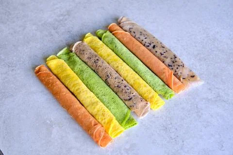 Pancakes of different color. Spinach, beetroot powder, blueberry and turmeric Stock Photos