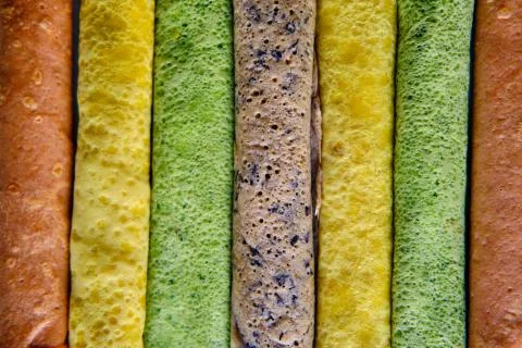 Pancakes of different color. Spinach, beetroot powder, blueberry and turmeric Stock Photos