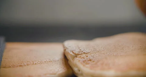 Pancakes fall on each other in slow motion. Video in 4k Stock Footage 101195756