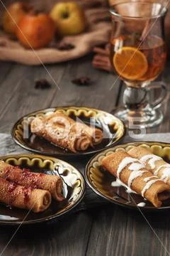 Pancakes with fillings. A treat for tea. Stock Photos