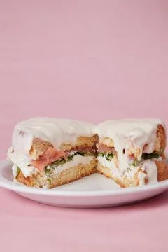 Pancakes with fish, lettuce leaves and vegetables, a hot dish for lunch Stock Photos