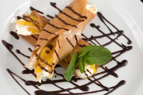 Pancakes with fruit. Stock Photos