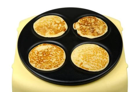 Pancakes on griddle Stock Photos