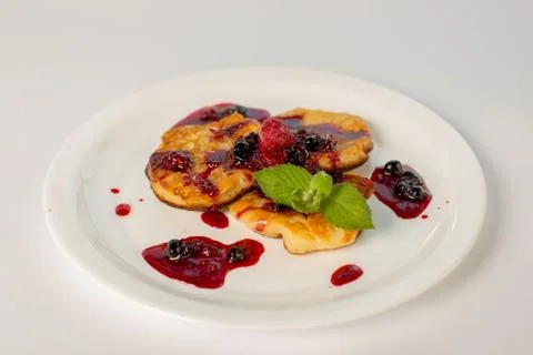 Pancakes with jam on a white background Stock Photos