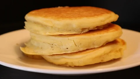 Pancakes Knife Spreading Butter on Stack of Pancakes White Plate Video stock 127264821