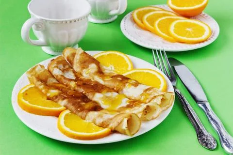 Pancakes with  oranges Stock Photos