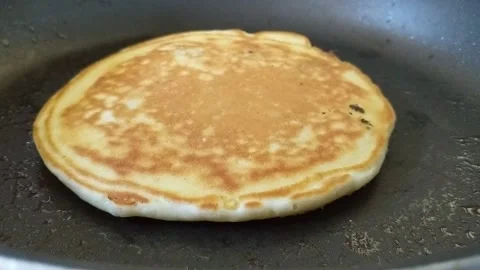 Pancakes on the pan Stock Footage 219588954