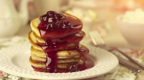 Pancakes with pouring cherry jam Stock Footage 57283305