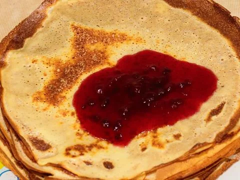 Pancakes with raspberry jam Stock Photos