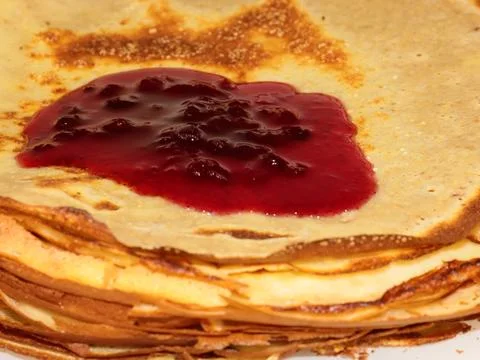 Pancakes with raspberry jam Stock Photos