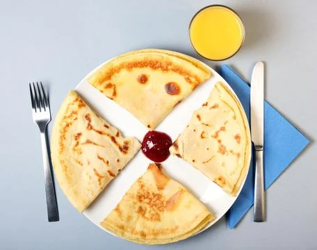 Pancakes with raspberry jam Stock Photos
