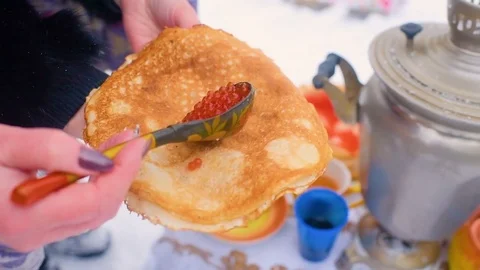Pancakes with red caviar close-up on the background of the festive table Stock Footage 84916911