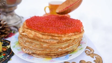 Pancakes with red caviar close-up on the background of the festive table Stock Footage 84917832