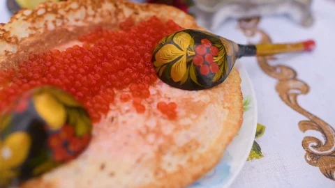 Pancakes with red caviar close-up on the background of the festive table Stock-Footage 84919215