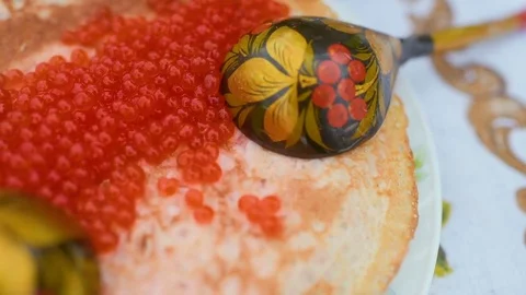 Pancakes with red caviar close-up on the background of the festive table Stock Footage 84919480