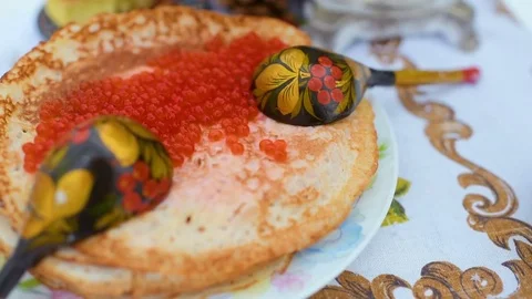 Pancakes with red caviar close-up on the background of the festive table Stock Footage 84919552