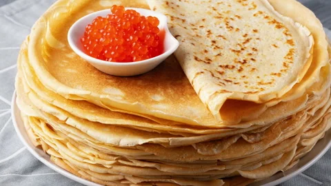 Pancakes with red caviar on grey background Stock Footage 265667313